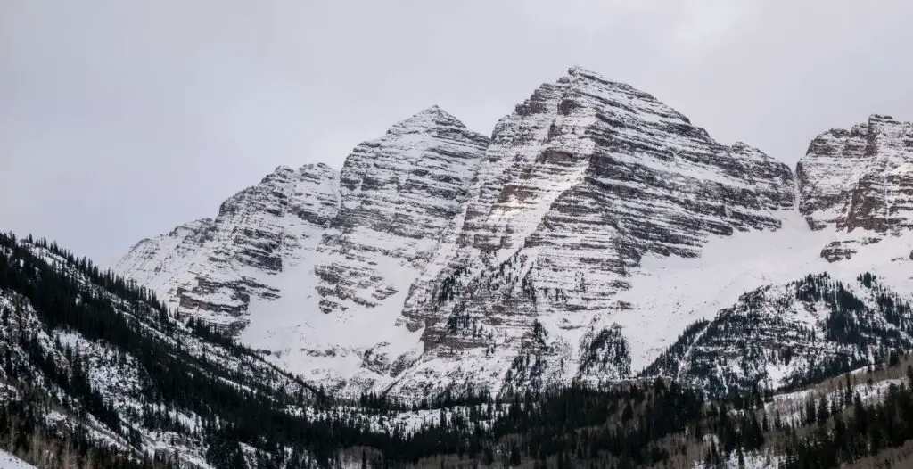 Snow-covered mountains in Aspen, showcasing the breathtaking scenery during the best time to visit Aspen.