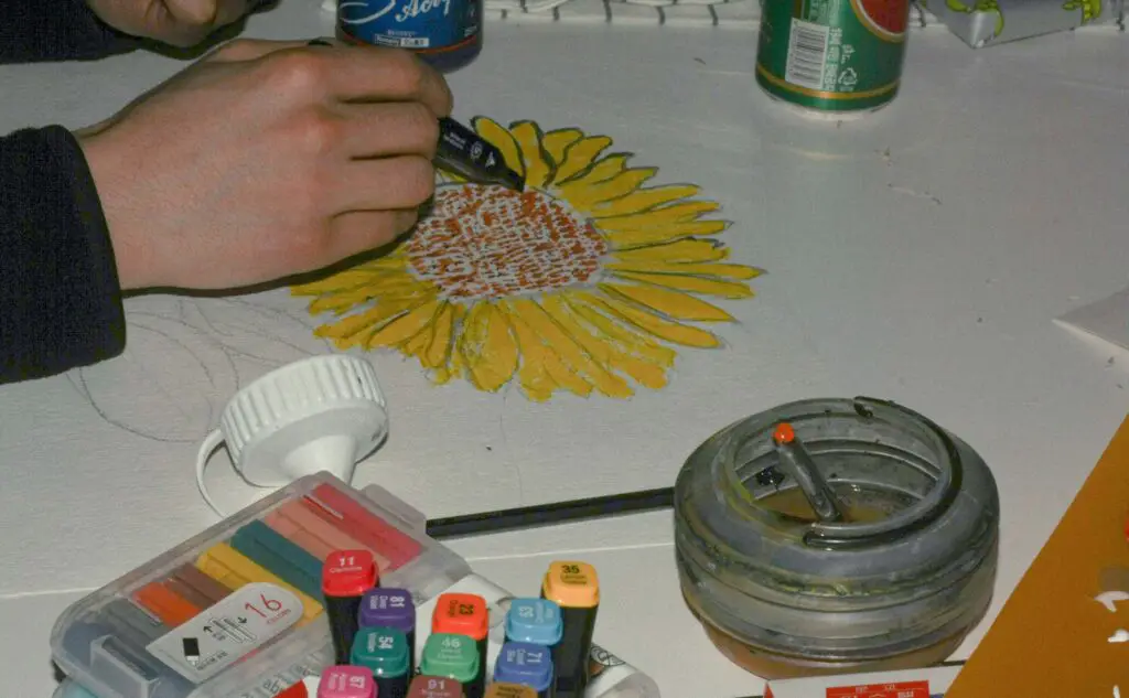 Creative Art & Craft Workshops: Ignite Your Imagination in Chicago Hand painting on a canvas during a creative workshop, representing fun group art activities for adults in Chicago.