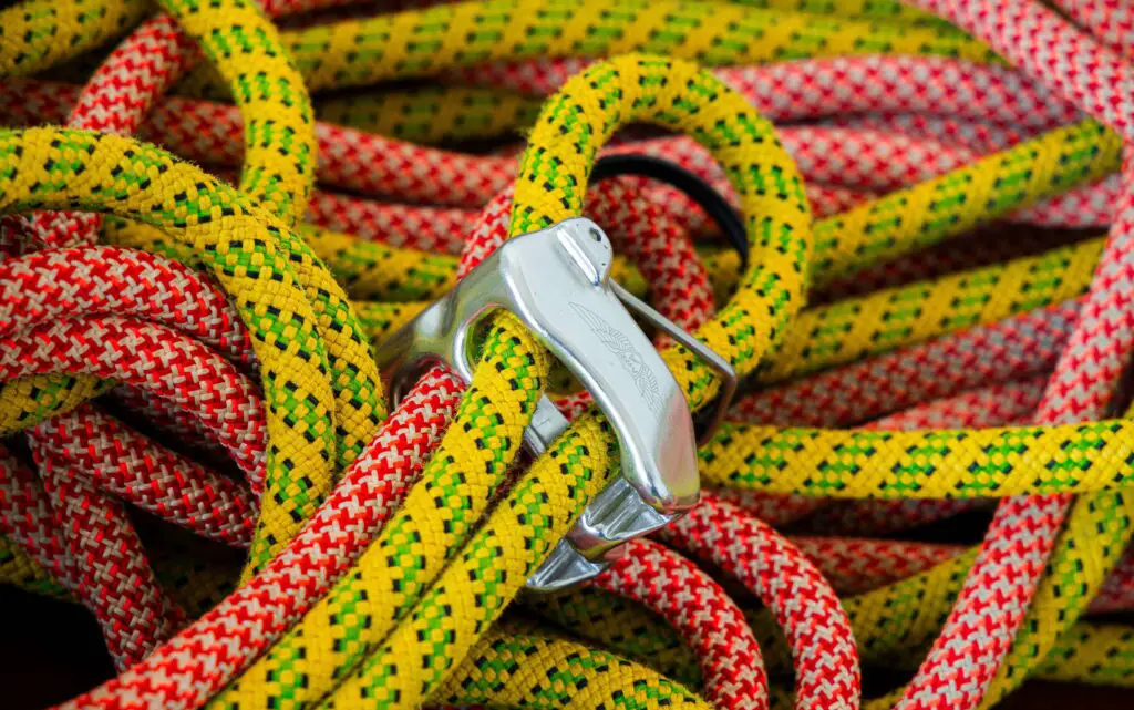 Adventure Ropes Courses: Test Your Teamwork with Fun Group Activities in Chicago Group of adults navigating a high ropes course, building teamwork and having fun outdoors in Chicago.