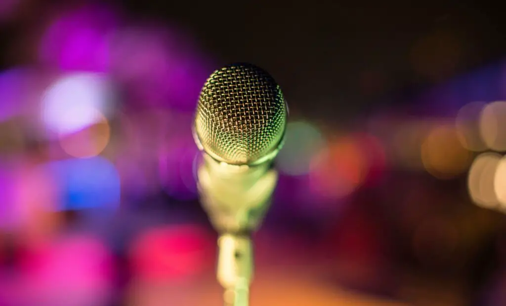 Music Jam Sessions and Karaoke Nights: Unleash Your Inner Star in Chicago A microphone on stage ready for karaoke night, symbolizing music jam sessions and fun group activities for adults in Chicago.