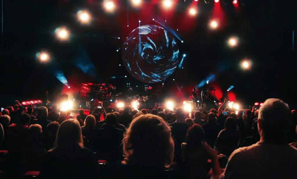 The Future of Music Experiences and Creative Evolution: Galena Concert Highlights Modern concert setup with stylish decorations and a lively crowd enjoying the music at a Galena event.