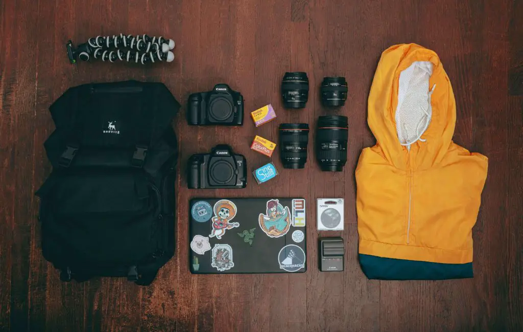 Family-Friendly & Budget Adventures: Things to Do in New York City Flat lay of essential travel items including a map, camera, reusable water bottle, snacks, and a small backpack—perfect for a family trip to NYC.