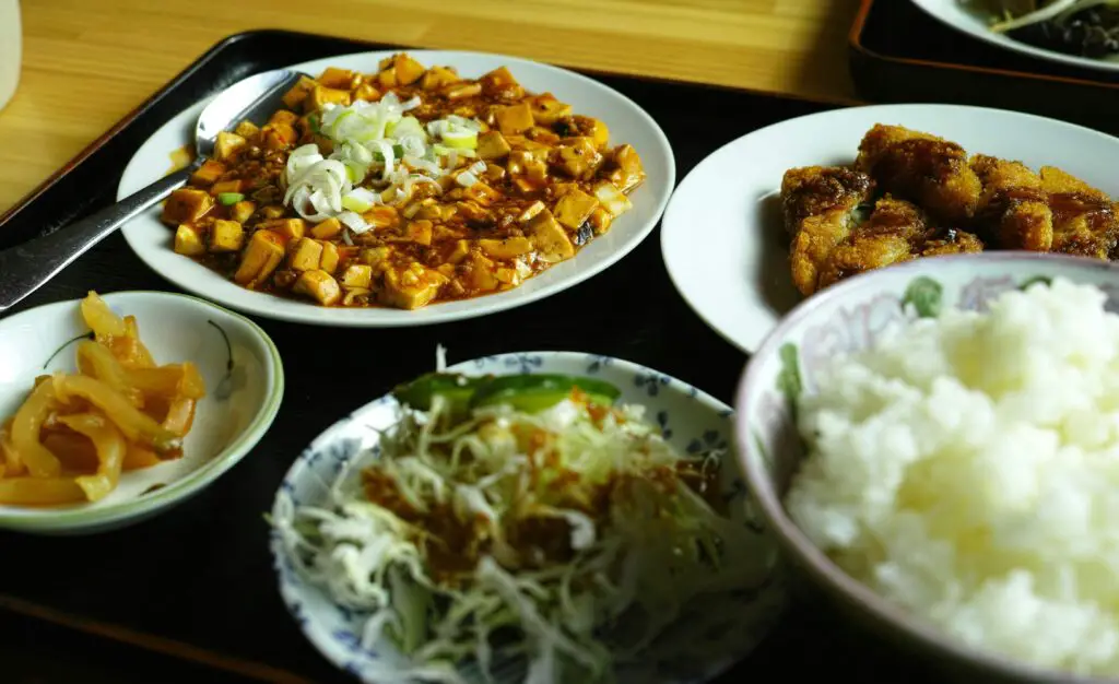 A variety of colorful and flavorful dishes served on a table at a local restaurant in East Village, NYC.