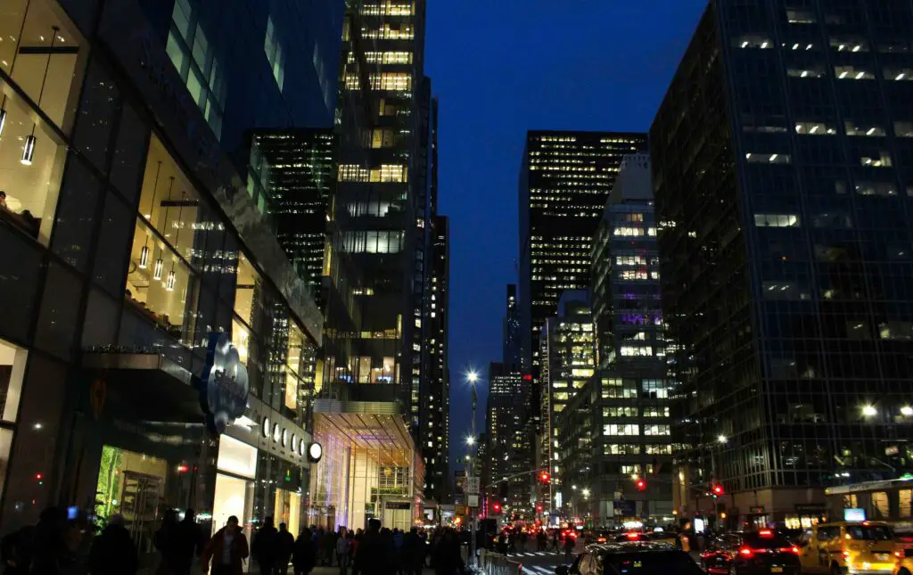 SoHo NYC Nightlife Recommendations: Vibrant After-Dark Escapades Nighttime scene in SoHo NYC with lively crowds, illuminated storefronts, and a vibrant city atmosphere.
