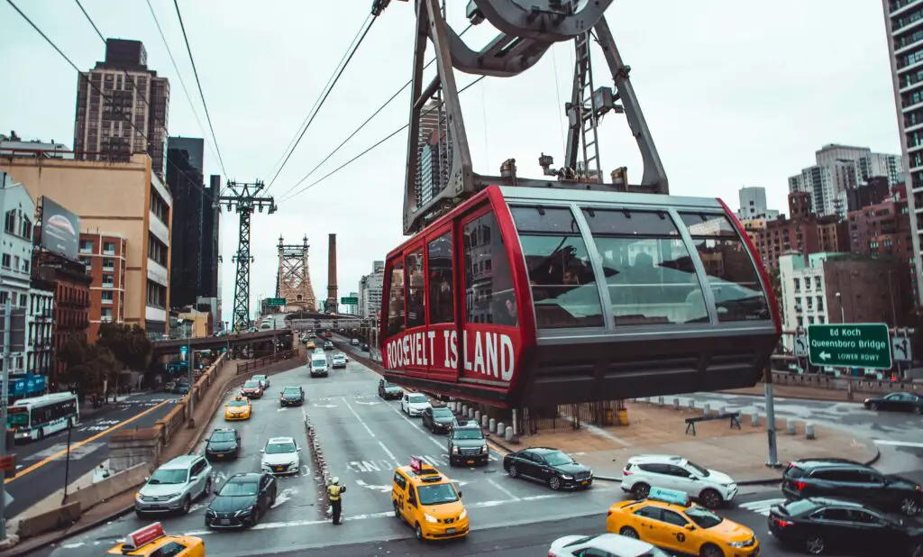 Discovering Roosevelt Island's Unique Charm: Things to Do on Roosevelt Island The Roosevelt Island Tramway gliding above the East River, offering stunning views of Manhattan and Roosevelt Island.