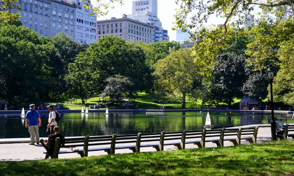 Greenwich Village Parks and Green Spaces: Best Activities for Tourists Urban park with a central lake surrounded by trees and buildings, offering a peaceful retreat in the heart of Greenwich Village.