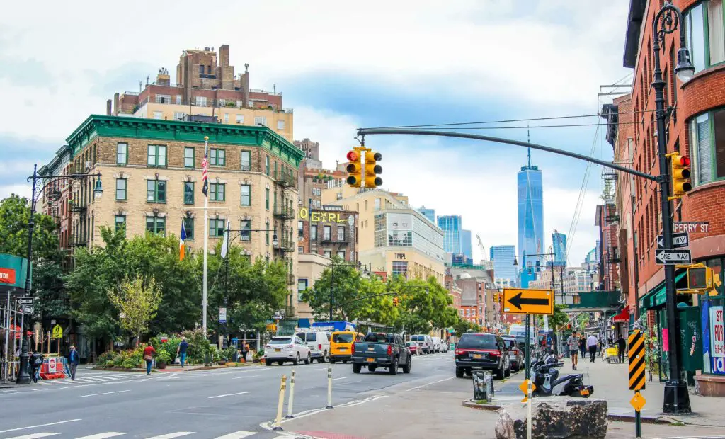 View of the city center in New York’s West Village, with lively streets, historic buildings, and people exploring.