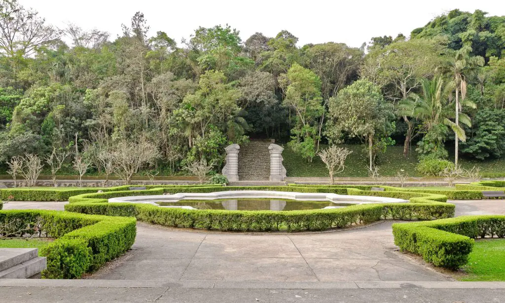 Discover the Neighborhood's Secret Gardens & Quiet Spaces: West Village Things to Do A beautiful hidden garden in the West Village, filled with greenery and offering a peaceful escape from the city.